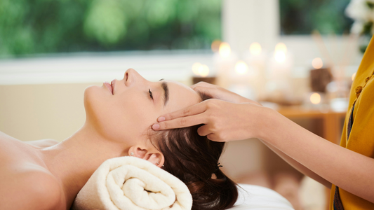 Woman getting a body massage on her temples